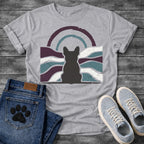 French Bulldog t-shirt with Frenchie silhouette seen from behind centered in a distressed wavy landscape of deep plum teal and cream, double concentric arch with arrow detail above, heavy vintage texture throughout, no text moody art graphic