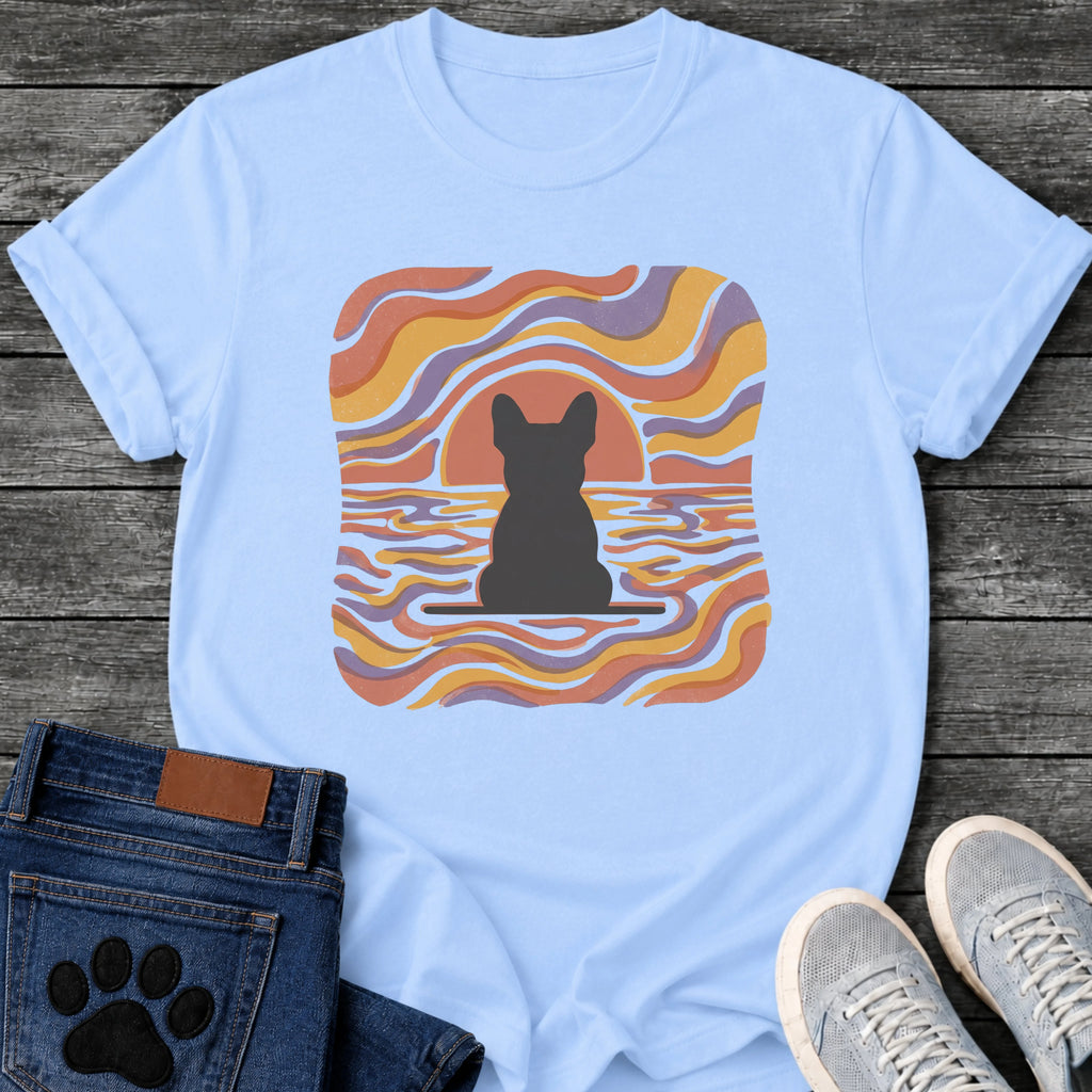 French Bulldog t-shirt with Frenchie silhouette seen from behind on a baseline inside a rounded square, swirling wavy lines filling the frame in terracotta gold and soft purple, terracotta sun arc rising behind the head, distressed texture, no text psychedelic art graphic