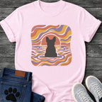 French Bulldog t-shirt with Frenchie silhouette seen from behind on a baseline inside a rounded square, swirling wavy lines filling the frame in terracotta gold and soft purple, terracotta sun arc rising behind the head, distressed texture, no text psychedelic art graphic