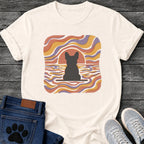 French Bulldog t-shirt with Frenchie silhouette seen from behind on a baseline inside a rounded square, swirling wavy lines filling the frame in terracotta gold and soft purple, terracotta sun arc rising behind the head, distressed texture, no text psychedelic art graphic