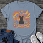 French Bulldog t-shirt with Frenchie silhouette seen from behind on a baseline inside a rounded square, swirling wavy lines filling the frame in terracotta gold and soft purple, terracotta sun arc rising behind the head, distressed texture, no text psychedelic art graphic