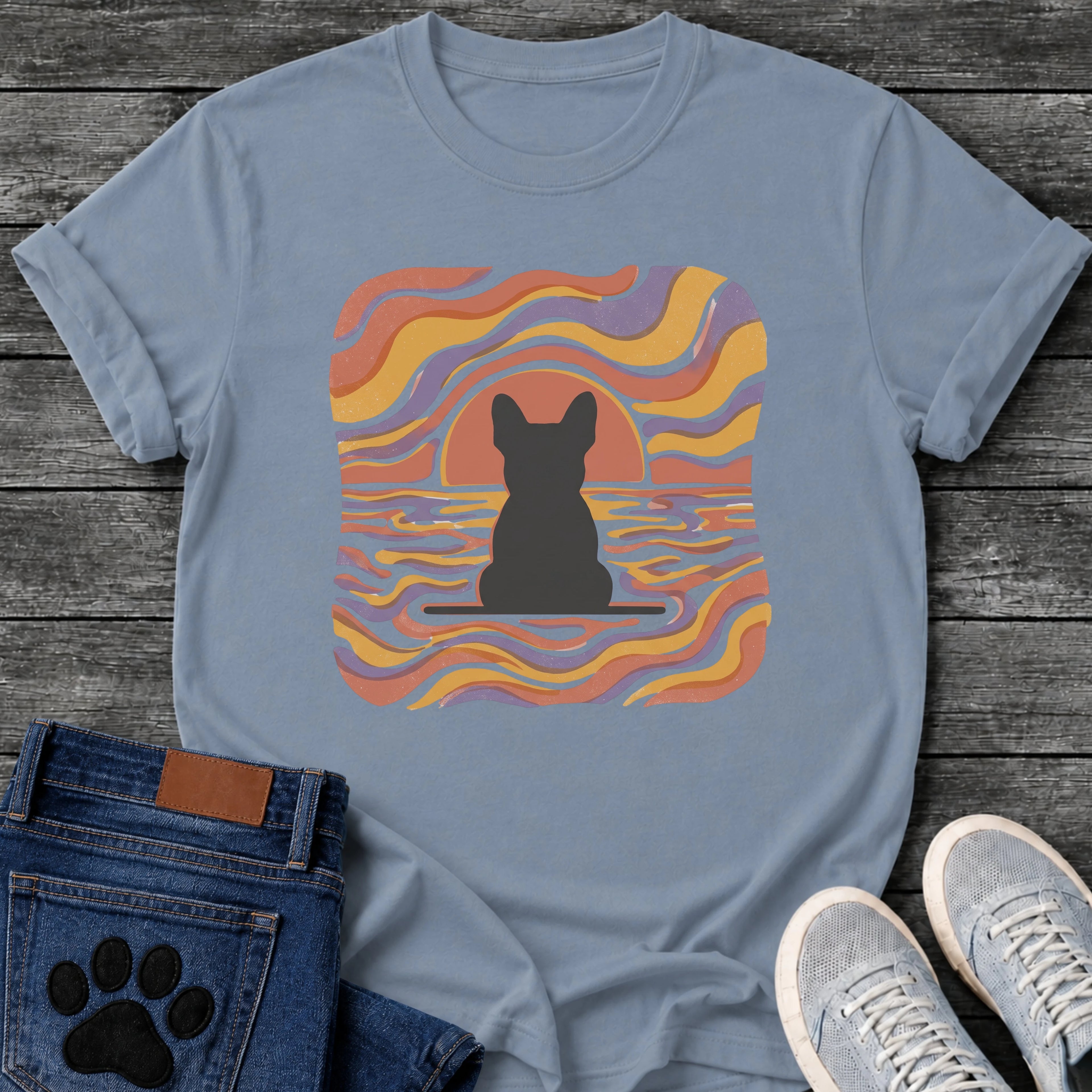 French Bulldog t-shirt with Frenchie silhouette seen from behind on a baseline inside a rounded square, swirling wavy lines filling the frame in terracotta gold and soft purple, terracotta sun arc rising behind the head, distressed texture, no text psychedelic art graphic