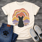 French Bulldog t-shirt with Frenchie silhouette seen from behind centered in a layered organic landscape of terracotta gold and soft purple flowing forms, color rippling in a water reflection below, no text warm painterly art graphic