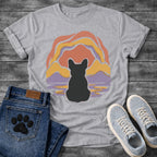 French Bulldog t-shirt with Frenchie silhouette seen from behind centered in a layered organic landscape of terracotta gold and soft purple flowing forms, color rippling in a water reflection below, no text warm painterly art graphic