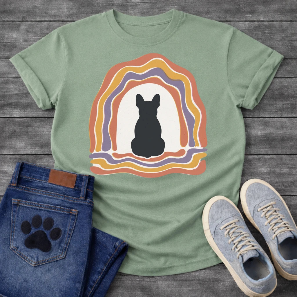 French Bulldog t-shirt with Frenchie silhouette seen from behind centered in a cream open space, surrounded by layered organic concentric arch in terracotta gold and soft purple, wavy lines trailing below, no text soft boho art graphic
