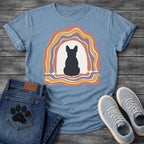 French Bulldog t-shirt with Frenchie silhouette seen from behind centered in a cream open space, surrounded by layered organic concentric arch in terracotta gold and soft purple, wavy lines trailing below, no text soft boho art graphic
