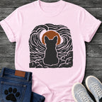 French Bulldog t-shirt with Frenchie silhouette seen from behind sitting on cracked rock, bold swirling woodcut style sky in black and cream surrounding a terracotta moon, heavy linocut print texture throughout, no text dramatic art graphic
