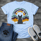 French Bulldog t-shirt with Frenchie silhouette seen from behind on a baseline, spray paint mountain landscape in deep plum teal and gold behind, segmented stencil arch above, ink splatter throughout, no text urban nature art graphic
