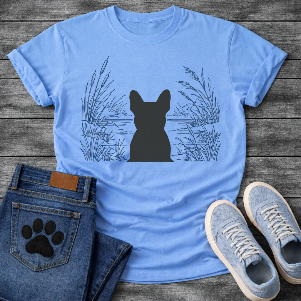 French Bulldog t-shirt with Frenchie silhouette seen from behind centered in a detailed navy line art botanical scene, cattails and tall reeds on either side, still water and distant shoreline ahead, no text refined nature illustration graphic
