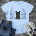 French Bulldog t-shirt with Frenchie silhouette seen from behind centered in a detailed navy line art botanical scene, cattails and tall reeds on either side, still water and distant shoreline ahead, no text refined nature illustration graphic
