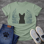 French Bulldog t-shirt with Frenchie silhouette seen from behind centered in a detailed navy line art botanical scene, cattails and tall reeds on either side, still water and distant shoreline ahead, no text refined nature illustration graphic
