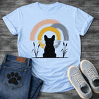 French Bulldog t-shirt with Frenchie silhouette seen from behind sitting between cattail reeds, overlapping brushstroke circles in blush pink gold and slate blue behind with water ripple detail, minimal ink ground line, no text soft zen art graphic

