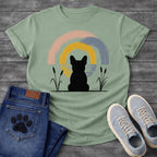 French Bulldog t-shirt with Frenchie silhouette seen from behind sitting between cattail reeds, overlapping brushstroke circles in blush pink gold and slate blue behind with water ripple detail, minimal ink ground line, no text soft zen art graphic
