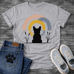 French Bulldog t-shirt with Frenchie silhouette seen from behind sitting between cattail reeds, overlapping brushstroke circles in blush pink gold and slate blue behind with water ripple detail, minimal ink ground line, no text soft zen art graphic
