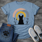 French Bulldog t-shirt with Frenchie silhouette seen from behind sitting between cattail reeds, overlapping brushstroke circles in blush pink gold and slate blue behind with water ripple detail, minimal ink ground line, no text soft zen art graphic

