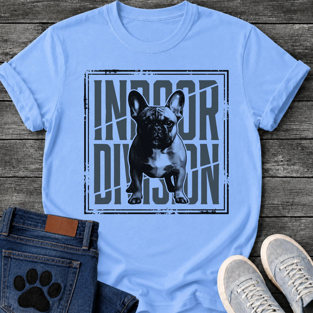 French Bulldog t-shirt with halftone Frenchie standing full body facing forward, oversized condensed slate blue text reading Indoor Division behind the portrait, diagonal slash detail, heavy distressed double border frame, black and slate two-color graphic
