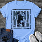 French Bulldog t-shirt with halftone Frenchie standing full body facing forward, oversized condensed slate blue text reading Indoor Division behind the portrait, diagonal slash detail, heavy distressed double border frame, black and slate two-color graphic

