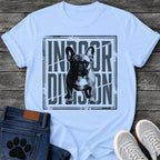 French Bulldog t-shirt with halftone Frenchie standing full body facing forward, oversized condensed slate blue text reading Indoor Division behind the portrait, diagonal slash detail, heavy distressed double border frame, black and slate two-color graphic
