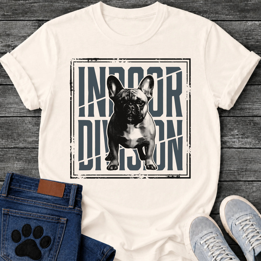 French Bulldog t-shirt with halftone Frenchie standing full body facing forward, oversized condensed slate blue text reading Indoor Division behind the portrait, diagonal slash detail, heavy distressed double border frame, black and slate two-color graphic
