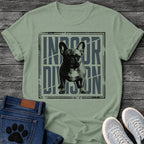 French Bulldog t-shirt with halftone Frenchie standing full body facing forward, oversized condensed slate blue text reading Indoor Division behind the portrait, diagonal slash detail, heavy distressed double border frame, black and slate two-color graphic
