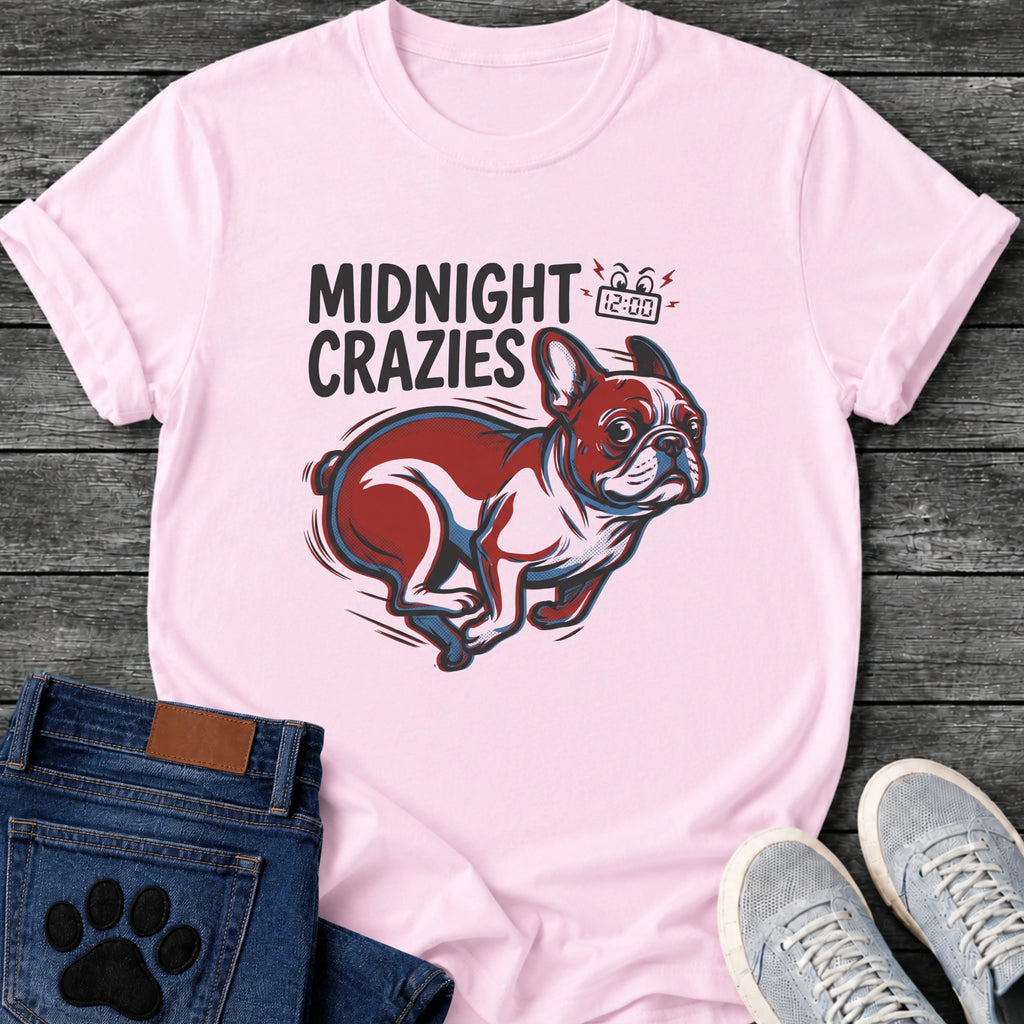 French Bulldog t-shirt with bold retro comic text reading Midnight Crazies upper left, animated alarmed clock showing 12:00 with lightning bolts and cartoon eyes, large red and blue halftone Frenchie running at full speed, speed lines throughout