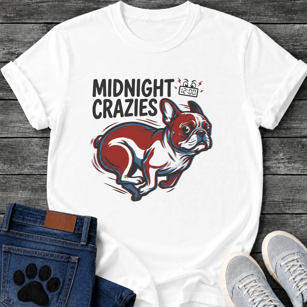 French Bulldog t-shirt with bold retro comic text reading Midnight Crazies upper left, animated alarmed clock showing 12:00 with lightning bolts and cartoon eyes, large red and blue halftone Frenchie running at full speed, speed lines throughout
