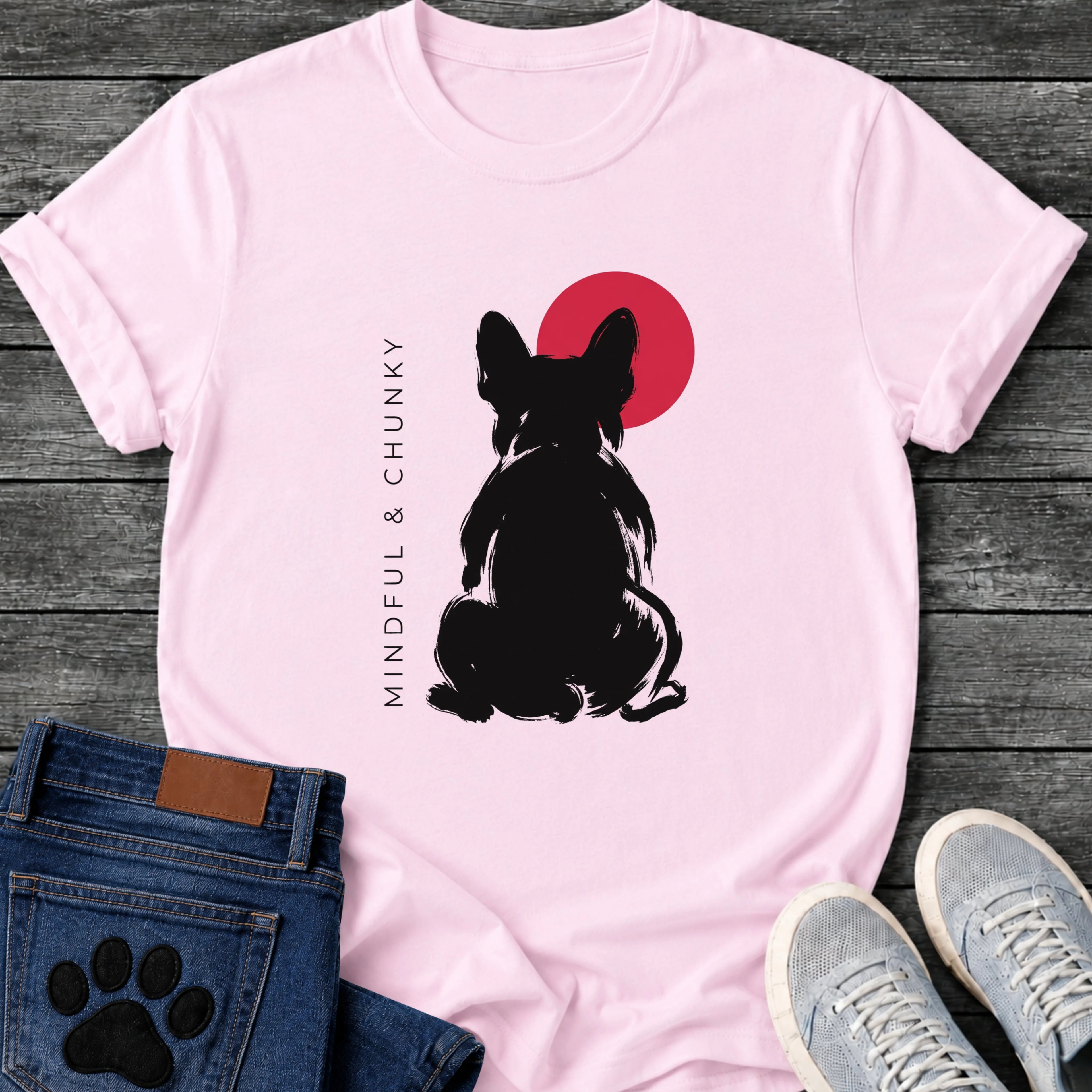 French Bulldog t-shirt with bold brush ink Frenchie seen from behind, single red circle behind the head, vertical spaced serif text reading Mindful and Chunky running along the left side, two-color black and red fine art graphic
