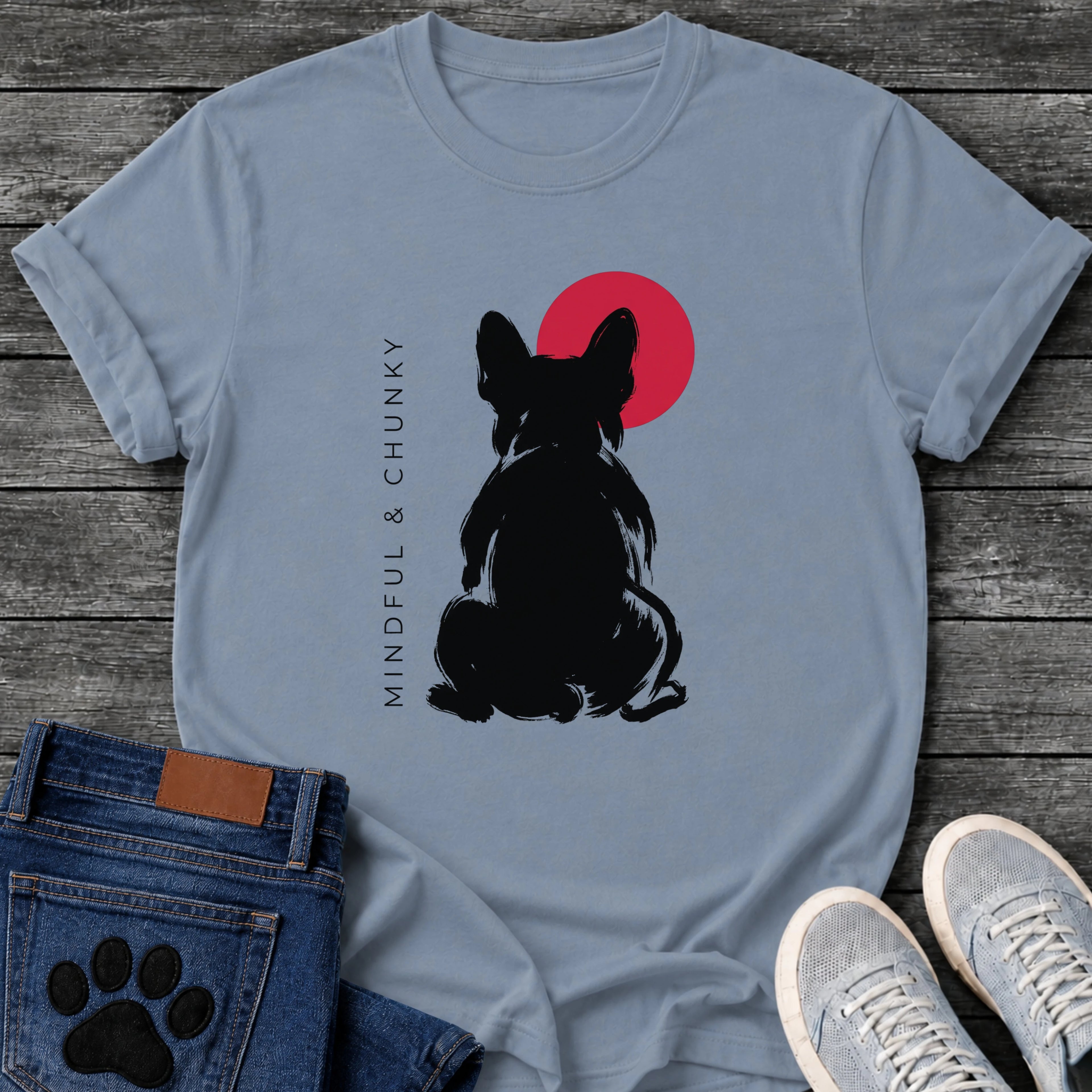 French Bulldog t-shirt with bold brush ink Frenchie seen from behind, single red circle behind the head, vertical spaced serif text reading Mindful and Chunky running along the left side, two-color black and red fine art graphic
