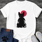 French Bulldog t-shirt with bold brush ink Frenchie seen from behind, single red circle behind the head, vertical spaced serif text reading Mindful and Chunky running along the left side, two-color black and red fine art graphic
