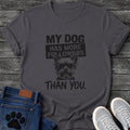 Bold graphic tee design featuring a small dog wearing sunglasses, with stamped text reading "My Dog Has More Followers Than You."