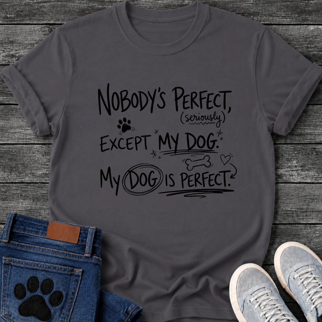 Hand drawn graphic tee design reading "Nobody's Perfect, Seriously, Except My Dog. My Dog Is Perfect," with doodled paw prints, stars, a bone, and a heart.