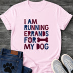 I Am Running Errands For My Dog t shirt design in bold cut paper style maroon and navy lettering with a paw print and bone icon