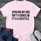 Bold graphic tee design reading "Spoiling My Dog Isn't a Choice, It's a Lifestyle," with a small paw print beside the text.