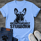French Bulldog t-shirt with high contrast halftone Frenchie portrait facing forward with ink splatter drip details, bold oversized stencil text below reading Uncompromisingly Stubborn, single black ink graphic with serious streetwear energy
