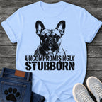 French Bulldog t-shirt with high contrast halftone Frenchie portrait facing forward with ink splatter drip details, bold oversized stencil text below reading Uncompromisingly Stubborn, single black ink graphic with serious streetwear energy
